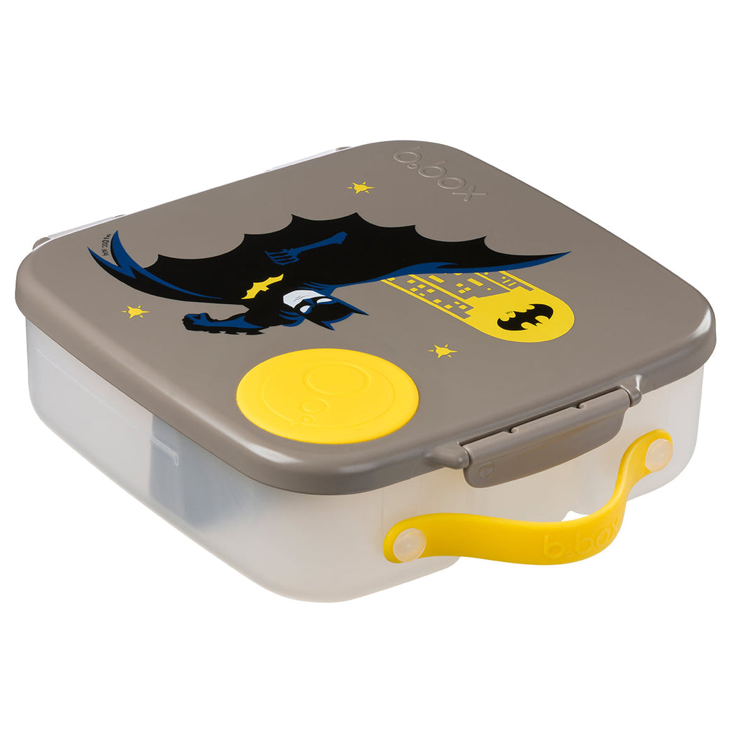 B.Box Batman lunch box closed at an angle showing yellow carry handle and clip