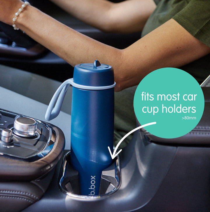 Flip top bottle fitting a car cup holder