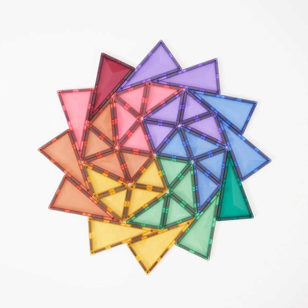 Connetix pastel triangle tiles arranged in a colourful spiral pattern