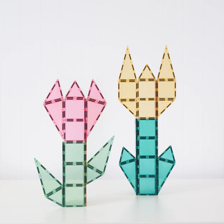 Pink and yellow flowers built with Connetix pastel magnetic tiles