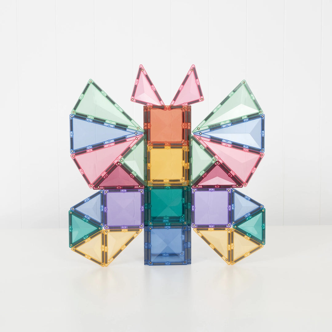 Butterfly design built with pastel square and triangle magnetic tiles