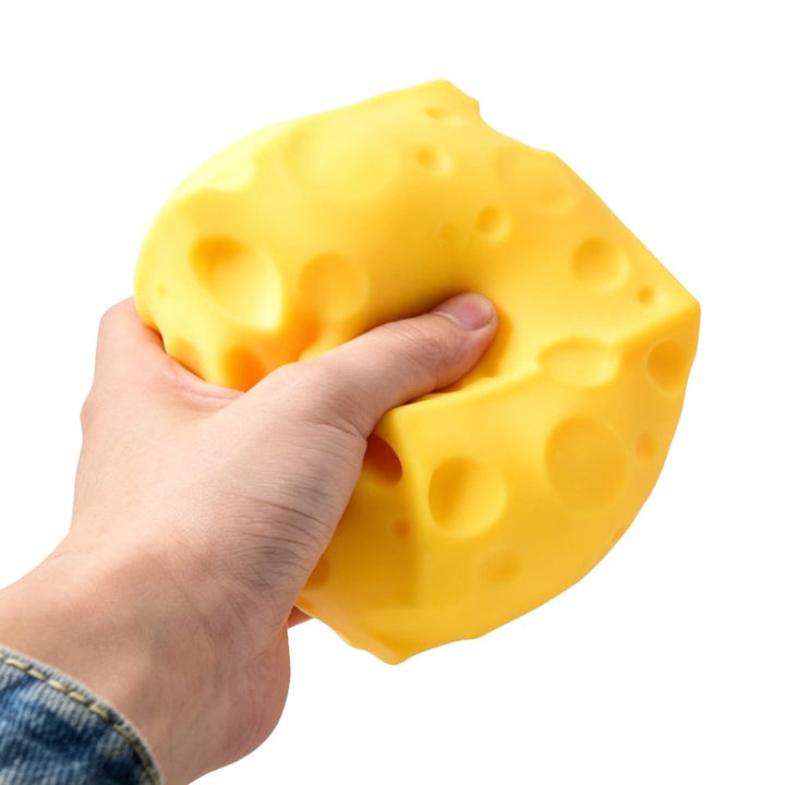 Epic Squish Cheezie cheese-shaped toy being squeezed by hand