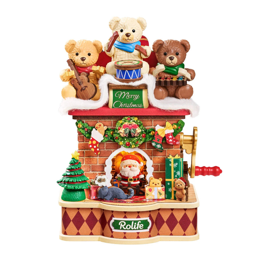 Rolife Christmas fireplace music box on white background, three teddy bears playing instruments above a Merry Christmas sign, brick fireplace with Santa, tree, gifts and red crank handle.