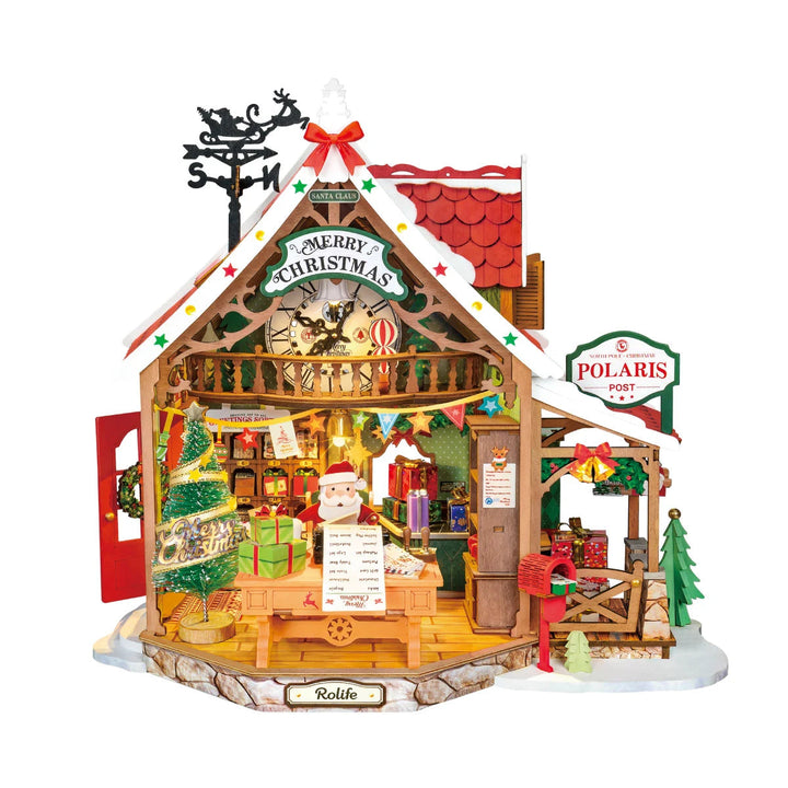 Rolife wooden miniature Christmas post office with red roof, Santa at desk, decorated tree, red mailbox, Polaris Post sign and Rolife nameplate on a white background.