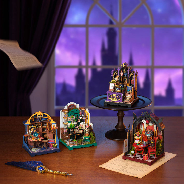 Four Halloween miniatures in a purple room display