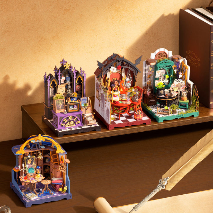 Four Halloween miniatures on a shelf