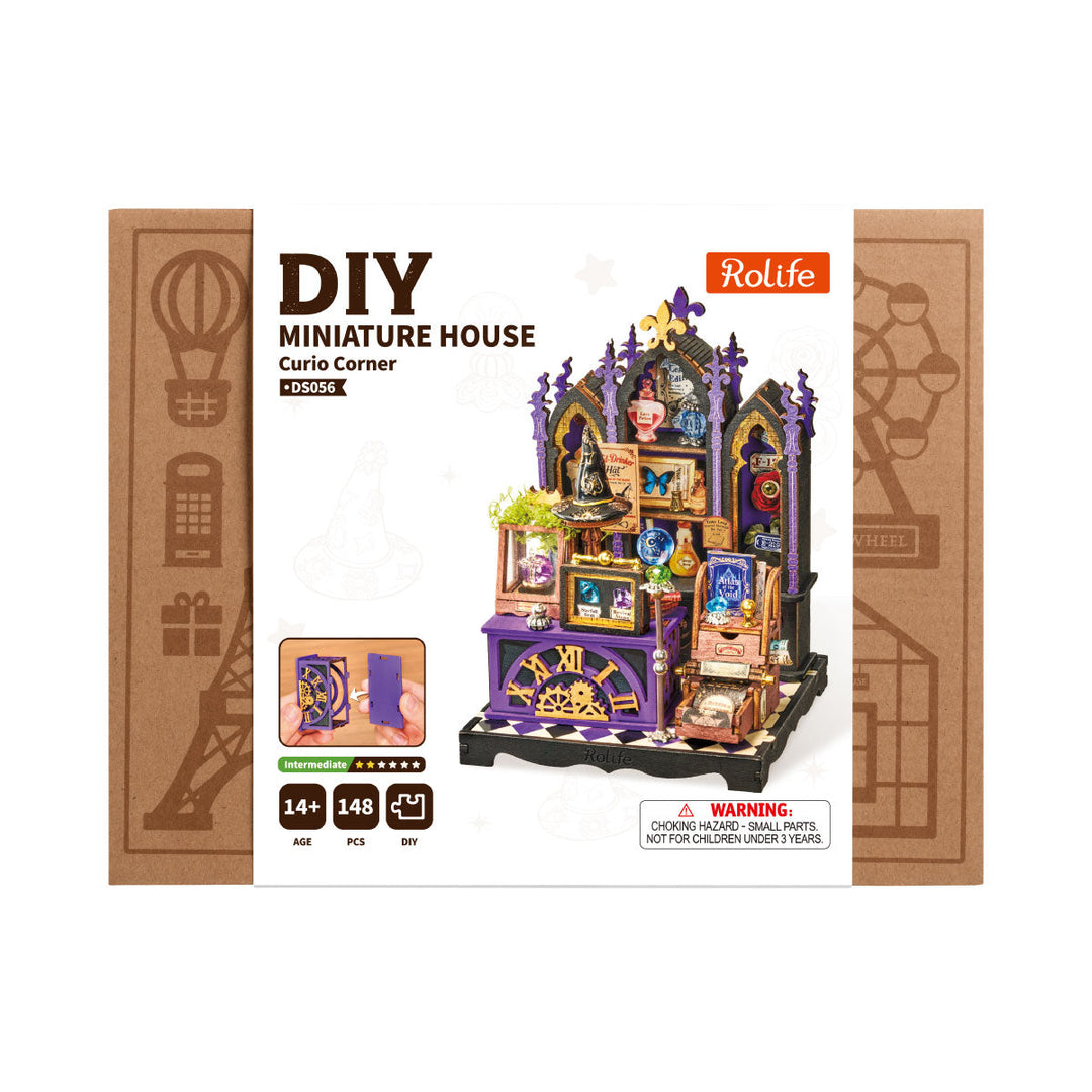 Four Halloween miniatures on a shelf