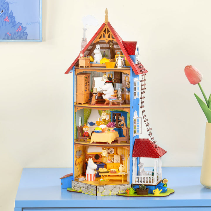 Rolife Moominhouse DIY miniature house displayed on a tabletop with interior rooms